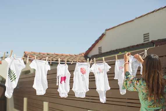 Hand-painted onesies at Kelly's bohemian baby shower by Bash Please | Lovechild Photography | 100 Layer Cakelet